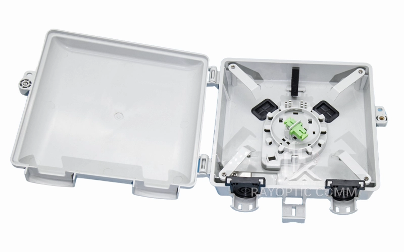 Top-down view of Fiber NID enclosure with open cover, showing internal structure, cable entry, and exit points.