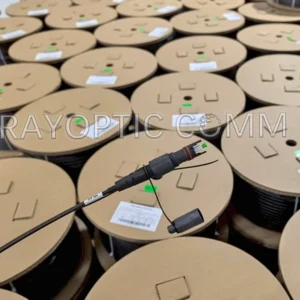 OptiTap to Stub flat dielectric fiber drop cables on cardboard reels, packaged at Rayoptic factory